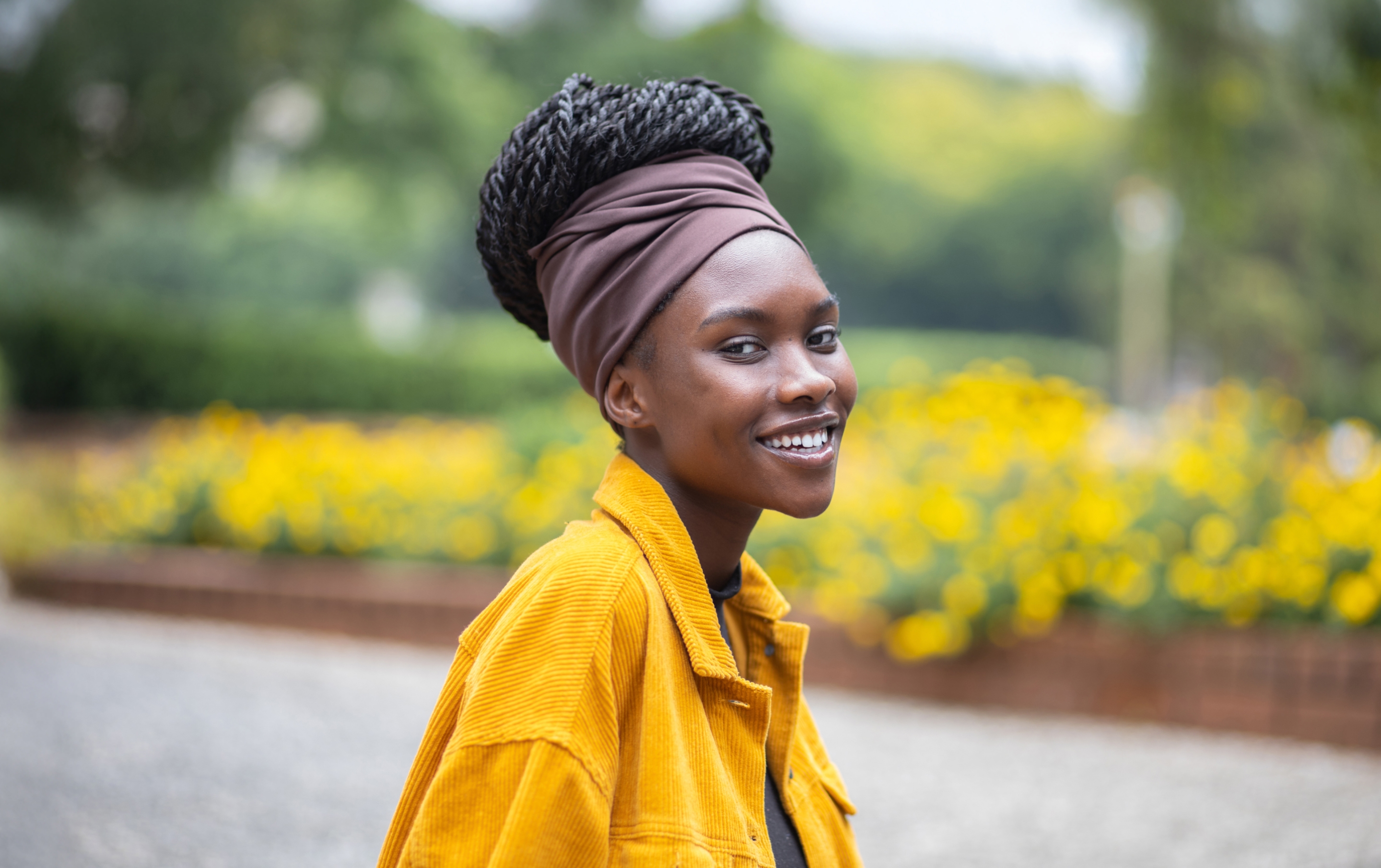 a woman smiling in a field
